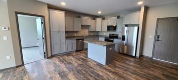 Melrose apartment for rent - a kitchen with white cabinets and a counter top