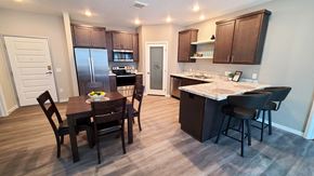 Lino Lakes apartment for rent - a kitchen and dining area with a table and chairs