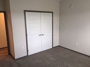 Cambridge apartment for rent - a room with a white door and a carpeted floor