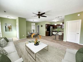 Sartell townhouse for rent - a living room with a couch and a table
