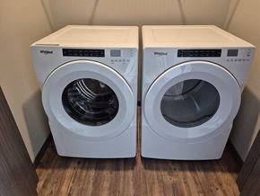 New York Mills apartment for rent - Two white Whirlpool washing machines in a small room.