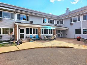 Big Lake apartment for rent - a patio in front of a house with an umbrella
