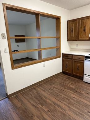 Twin Valley apartment for rent - a window in the floor of a room with wooden floors and cabinets