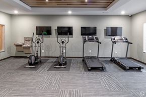 Cold Spring apartment for rent - a gym with treadmills and televisions on the wall
