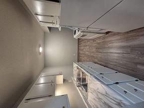 St Cloud apartment for rent - A kitchen with white cabinets and a marble countertop.