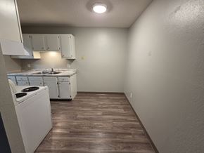 St Cloud apartment for rent - A small kitchen with a washer and dryer.