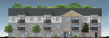 Aitkin apartment for rent - A modern apartment building with balconies and trees in the background.