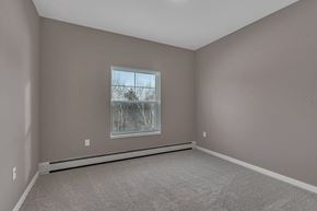 Little Falls apartment for rent - A room with a window showing a tree outside.