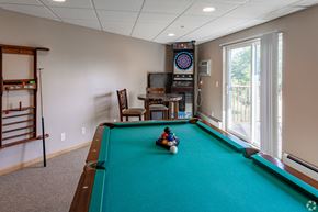 St Augusta apartment for rent - a game room with a pool table and a child playing on a