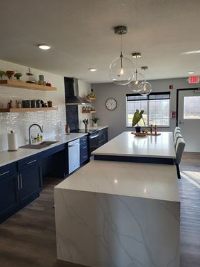 Alexandria apartment for rent - A kitchen with a white counter top and dark cabinets.