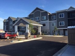 Cambridge apartment for rent - an apartment building with a red car parked in front of it