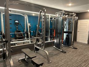 Baxter apartment for rent - a gym with weights and cardio equipment in a home gym