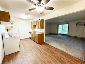 St Cloud apartment for rent - A kitchen with wooden floors and a white refrigerator.