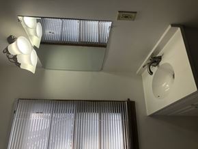 Morris apartment for rent - A bathroom with a sink and a window with blinds.