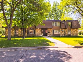 Little Falls apartment for rent - A house with a brown roof and a green lawn in front.