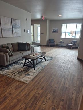 New York Mills apartment for rent - A living room with a couch, chairs, and a coffee table.