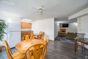 Apple Valley apartment for rent - A dining room with a wooden table and chairs.