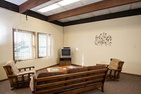 Little Falls townhouse for rent - A living room with a couch, chair, and television.