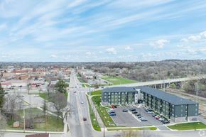 Faribault apartment for rent - an aerial view of a city with a building and a highway