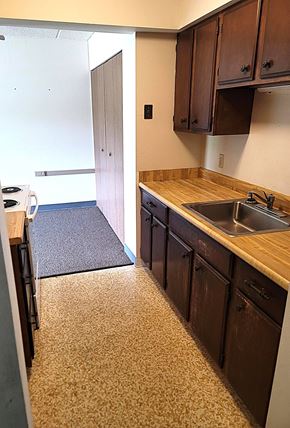 Hawley apartment for rent - A kitchen with a sink and cabinets.