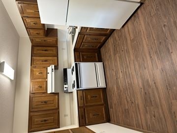 Twin Valley apartment for rent - A kitchen with wooden cabinets and drawers.
