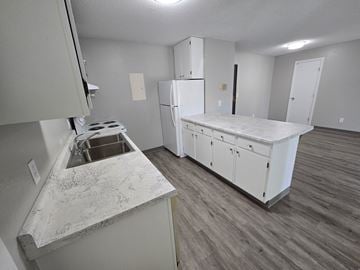 St Cloud apartment for rent - A kitchen with a white counter top and a white refrigerator.