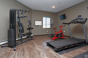 St Cloud apartment for rent - a gym with exercise equipment and a tv