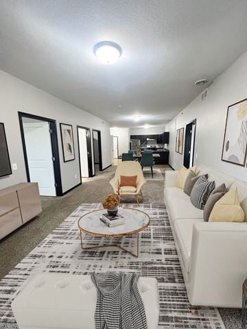 Mankato apartment for rent - A living room with a white couch and a coffee table.