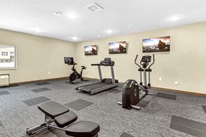 Cambridge apartment for rent - a rendering of a fitness room with a lot of luggage