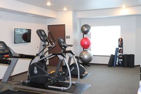 Hastings apartment for rent - a gym with two exercise machines and a yoga ball on the floor