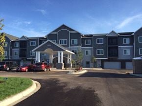 Cambridge apartment for rent - an apartment building with cars parked in front of it