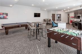 Hastings apartment for rent - a game room with two pool tables and a bar