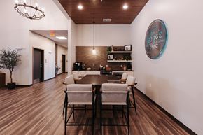 Cambridge apartment for rent - a dining room with a table and chairs and a wall with a sign on it