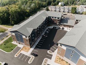 Cambridge apartment for rent - an aerial view of an apartment building with a parking lot
