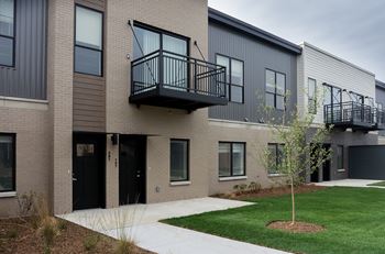 A modern two-story building with balconies