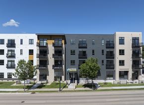Monona apartment for rent - A modern apartment building with a sign that says "BIG".