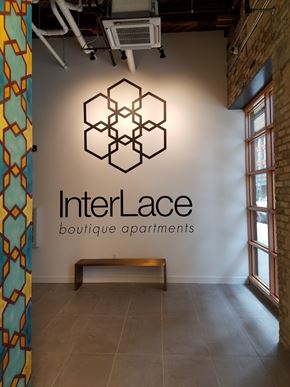 Milwaukee apartment for rent - A wall with a logo that says InterLace boutique apartments.