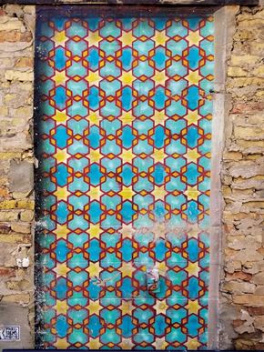 Milwaukee apartment for rent - A door with a pattern of blue and yellow stars.