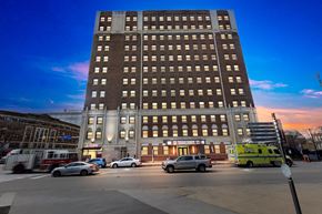 Cleveland apartment for rent - A large building with a parking lot in front of it.