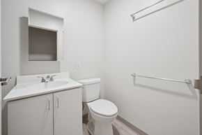 Worcester apartment for rent - A white bathroom with a toilet, sink, and shower.
