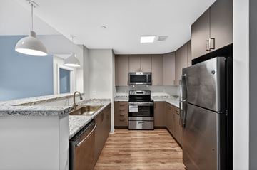 Boston apartment for rent - A modern kitchen with a large refrigerator and stainless steel appliances.