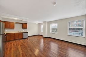 Cleveland apartment for rent - A kitchen with wooden floors and a refrigerator.