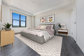 Boston apartment for rent - an open bedroom with a bed and a window