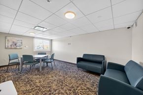 Dorchester apartment for rent - A conference room with a table and chairs.