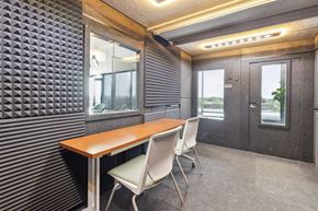 Chicago apartment for rent - A conference room with a wooden table and two chairs.