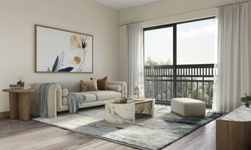 Chicago apartment for rent - a living room with a white couch and a large window
