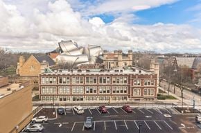 Cleveland apartment for rent - A modern building is situated in front of a traditional building.
