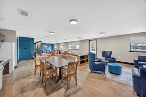 New Brunswick apartment for rent - A dining room with a table surrounded by chairs.