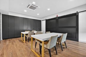 Boston apartment for rent - A dining room with a white table and chairs.