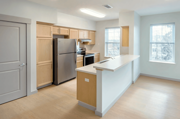Northampton apartment for rent - A kitchen with a refrigerator, stove, and oven.